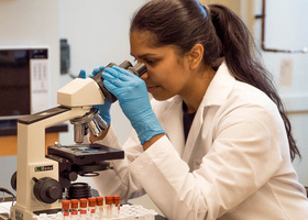 Woman looking into microscope.jpg