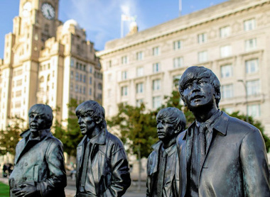 The Beatles Statue with Liver Building - VisitLiverpool